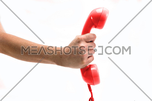 Red telephone receiver in hand