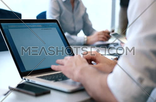 Close up for Young Businessman Hands Typing On Laptop Computer Keyboard at office