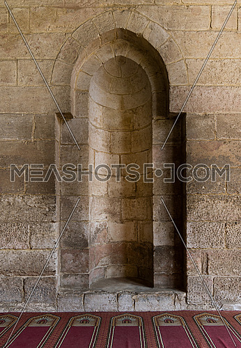 A stone wall with embedded niche in a historic mosque, Cairo, Egypt