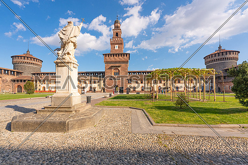 Amazing panoramic inner courtyard of the Sforzesco castle and the main tower,sunny day and clouds, Milan,Italy