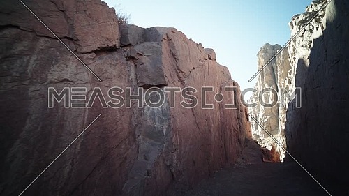 Track in for passage inside Sinai Mountain at day.