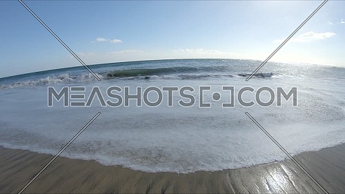 Follow shot for the Ocean, Sandy beach and waves