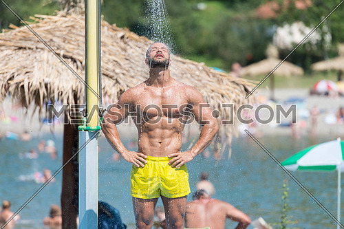 Handsome Man Doing A Shower In A Pool Spa Outdoors