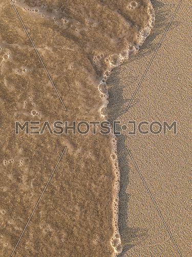Sea waves breaking on a clean sandy beach