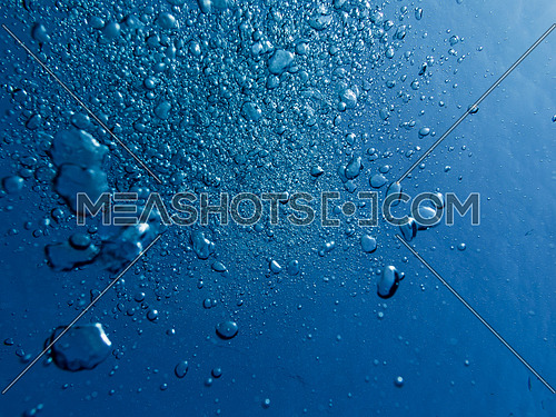 air bubbles in clear blue ocean water