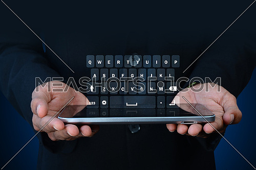 Man showing computer keys in color background