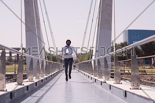 succesfull young business man jumping  and running