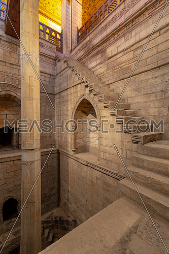 Deep well of Nilometer building with one column calibrated to measure the level of River Nile and staircase surrounding the well, River Nile, Cairo