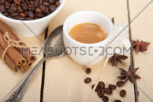 espresso coffee  over white wood rustic table  with sugar and spice