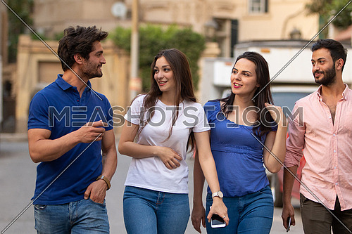 Group of young people walking in the street in korba area at day