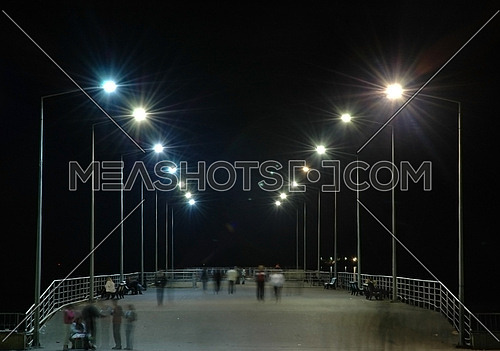 Row of lampposts and people - Baku, Azerbaijan