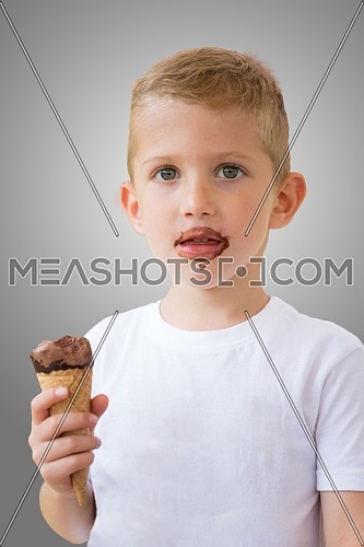 Baby boy kid hold chocolate ice cream in waffles cone isolated on gray background with free text copy space