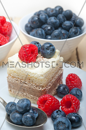 fresh homemade raspberry and blueberry cream cake