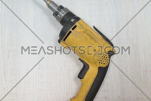 drill machine isolated on white old retro wood background