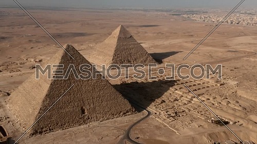 Wide shot of 3 pyramids of Giza at sunrise