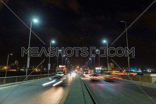 Long shot for traffic on Suez Canal Bridge at Alexandria at night