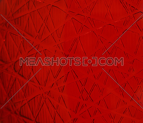 Red vivid bright abstract square background with polygon pattern of crossed lines on glass