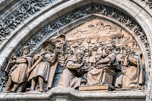 Sevilla, SPAIN - September 9, 2017: Adoration of the magicians adoring the child god, placed in the called "Puerta de Palos" realized in mud, in the cathedral of Sevilla, Spain