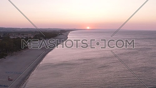 Aerial view of beautiful mediterranean sea and beach at sunrise, seascape of Calabria,  Simeri Mare, Southern Italy.