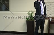 A business man standing talking on the phone
