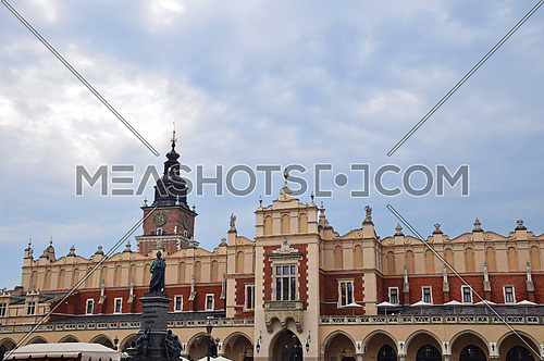 Low angle view of Town Hall tower and Cloth Hall (Sukiennice) at Main Market Square of Krakow, Poland
