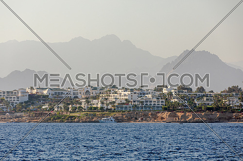 Long shot for El Shaikh City from the Red Sea by day.