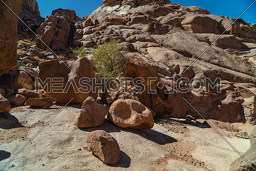Mid shot for rocks at Ain Hardra at Sinai Mountain at day.