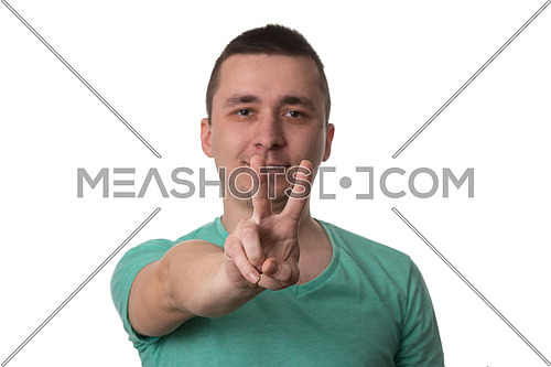 Portrait Of Young Man Giving Peace Sign - Isolated On White Background