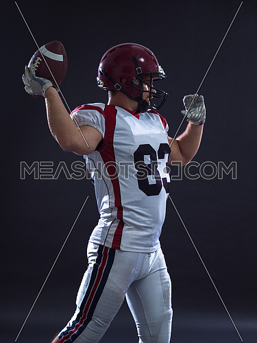one quarterback american football player throwing ball isolated on gray background