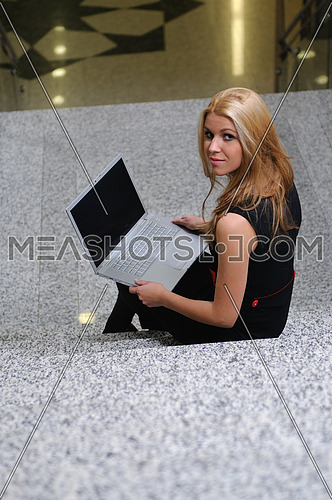 young business woman working wireless on laptop 
