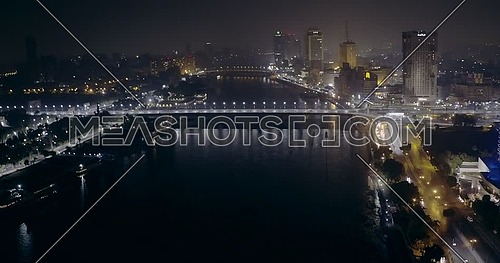 Aerial shot from drone fly around Kasr Al Nile Bridge in Cairo at night