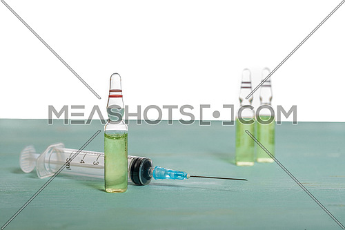 Medical vials and syringe isolated on white background, vaccination concept and disease treatments