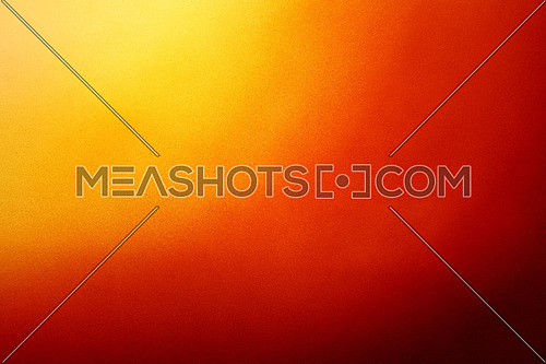 Abstract colorful background with grunge noise grain texture and vivid radial color gradient of red, orange, brown and yellow from corner