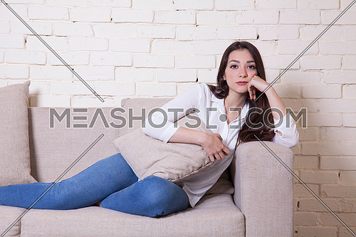 A girl sitting on a couch