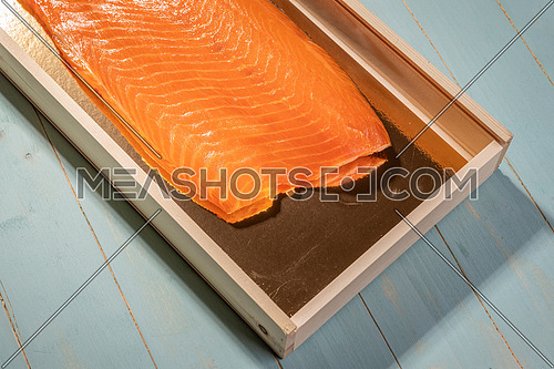 Smoked wild sockeye salmon inside wooden box