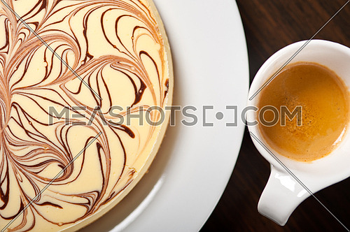 fresh baked classic Cheese cake with chocolate topping and coffee