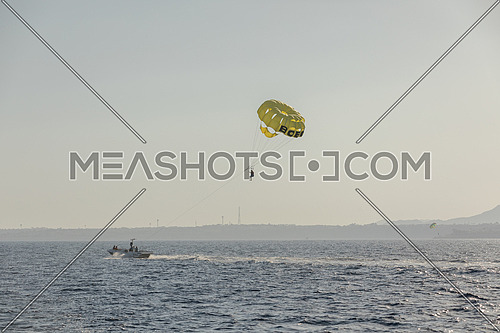 Long for for tourist parasailng in the Red Sea by day