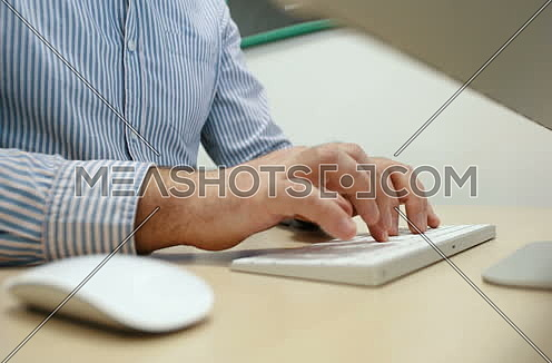 Young Businessman Hands Typing On Computer Keyboard in startup office