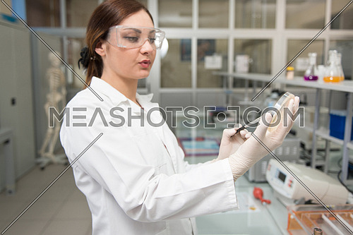 Young Woman Scientists Conducting Research In A Lab Environment