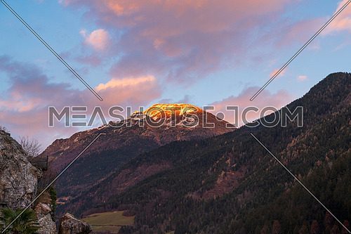 Awesome panorama of the snow-covered Orobie mountains of the Seriana Valley and the Sedornia Valley at sunset.