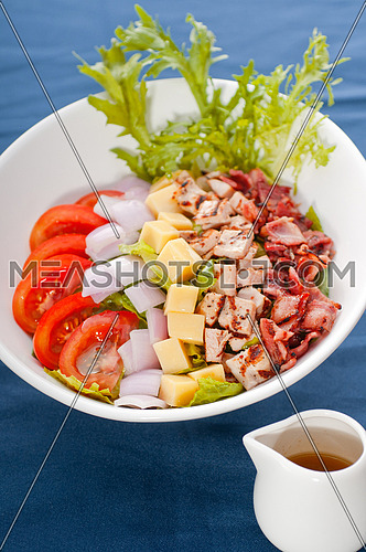 fresh classic caesar salad  over blue tablecloth close up,healthy meal ,MORE DELICIOUS FOOD ON PORTFOLIO