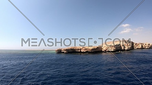 Long shot from Red Sea showing Ras Muhammed Island at day