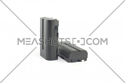 Two NP-F type rechargeable batteries isolated on a white background, electronics and camera equipment
