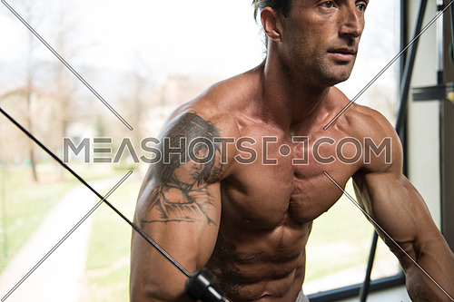 Muscular Mature Man Working Out Chest