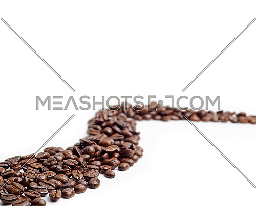 bounch of roasted coffee beans mimic a road shape