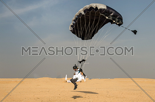 Some people practice skydiving and air sport in the desert
