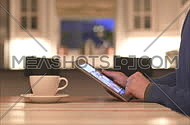 a man using electronic touch devices in a home