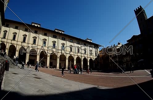 people walking on the Piazza Grande in Arezzo
