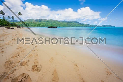 Exotic long exposure seascape during the day, on a public beach in Rincon Beach,Samana peninsula, Dominican Republic