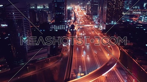 aerial top view of busy traffic on highway in Dubai at night 